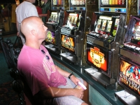 Chuck making donation to slot machines
